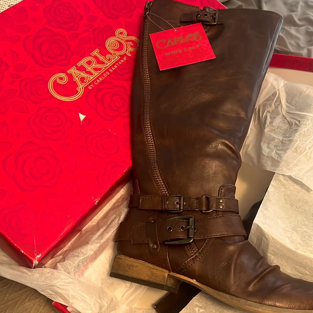 Brown knee high boots.